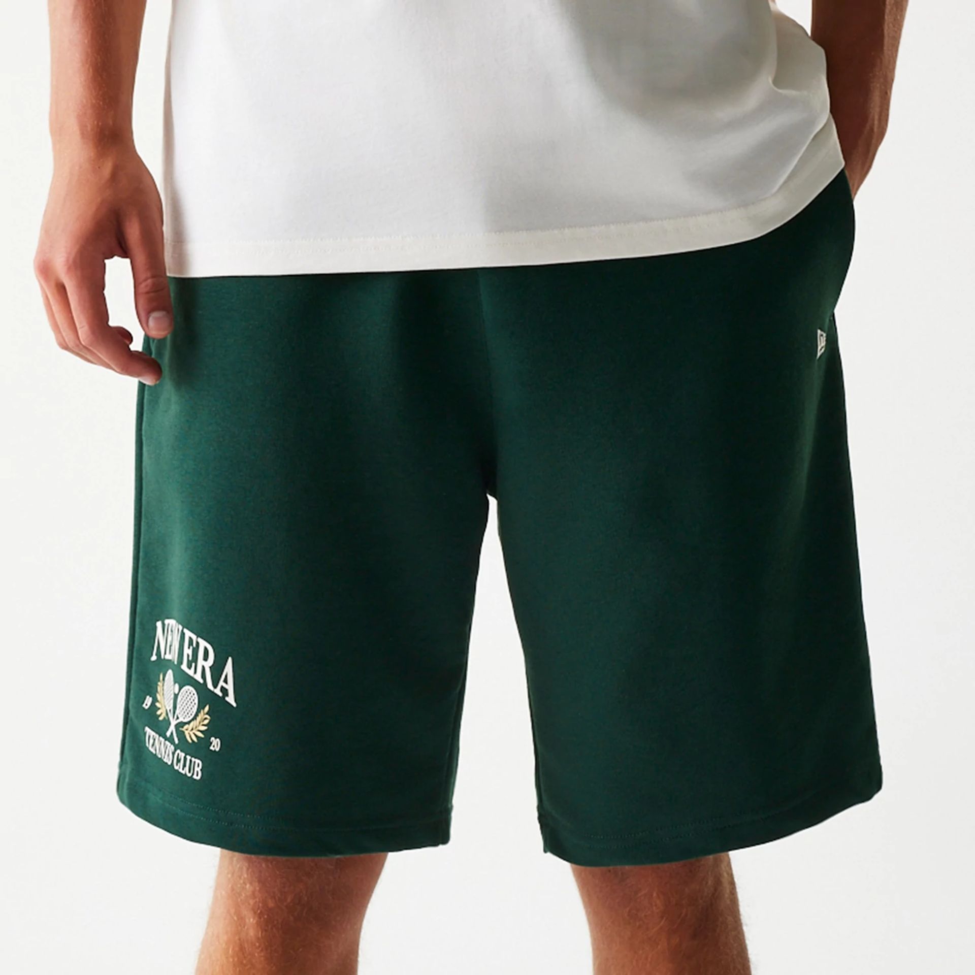 The Male model is wearing New Era Front Logo Dark Green Shorts 4