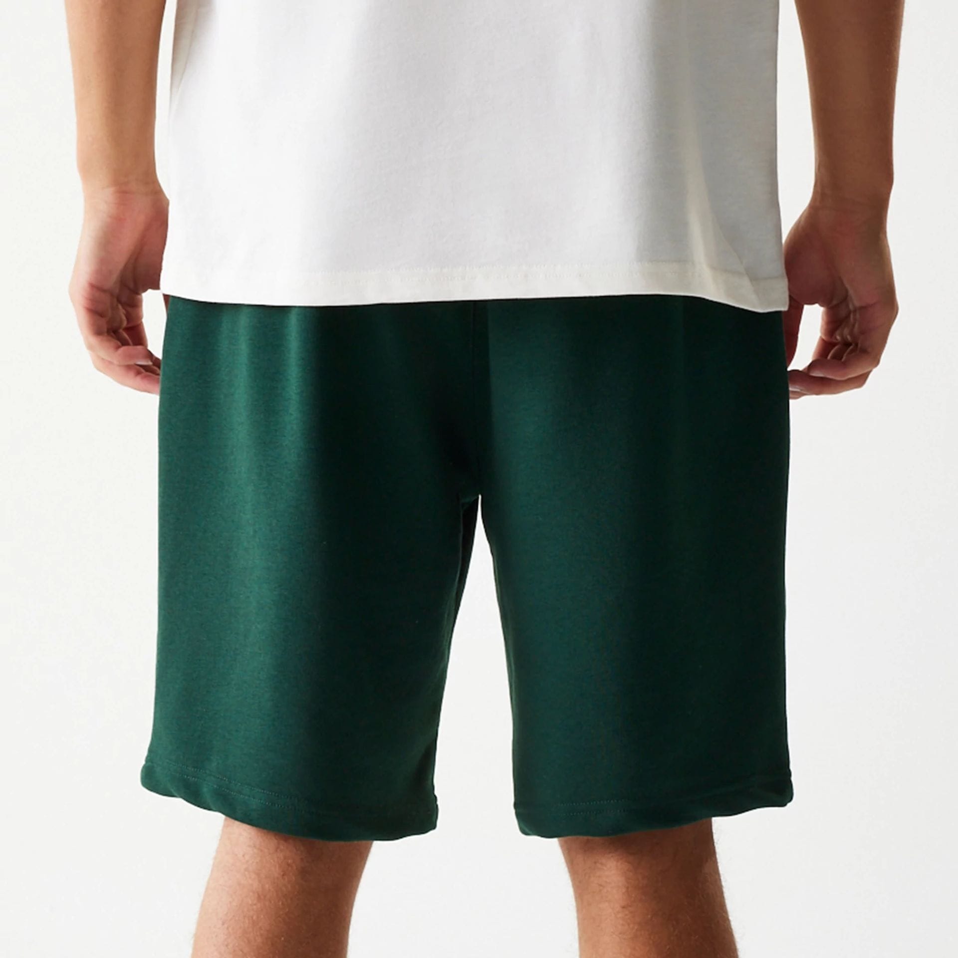 The Male model is wearing New Era Front Logo Dark Green Shorts 7