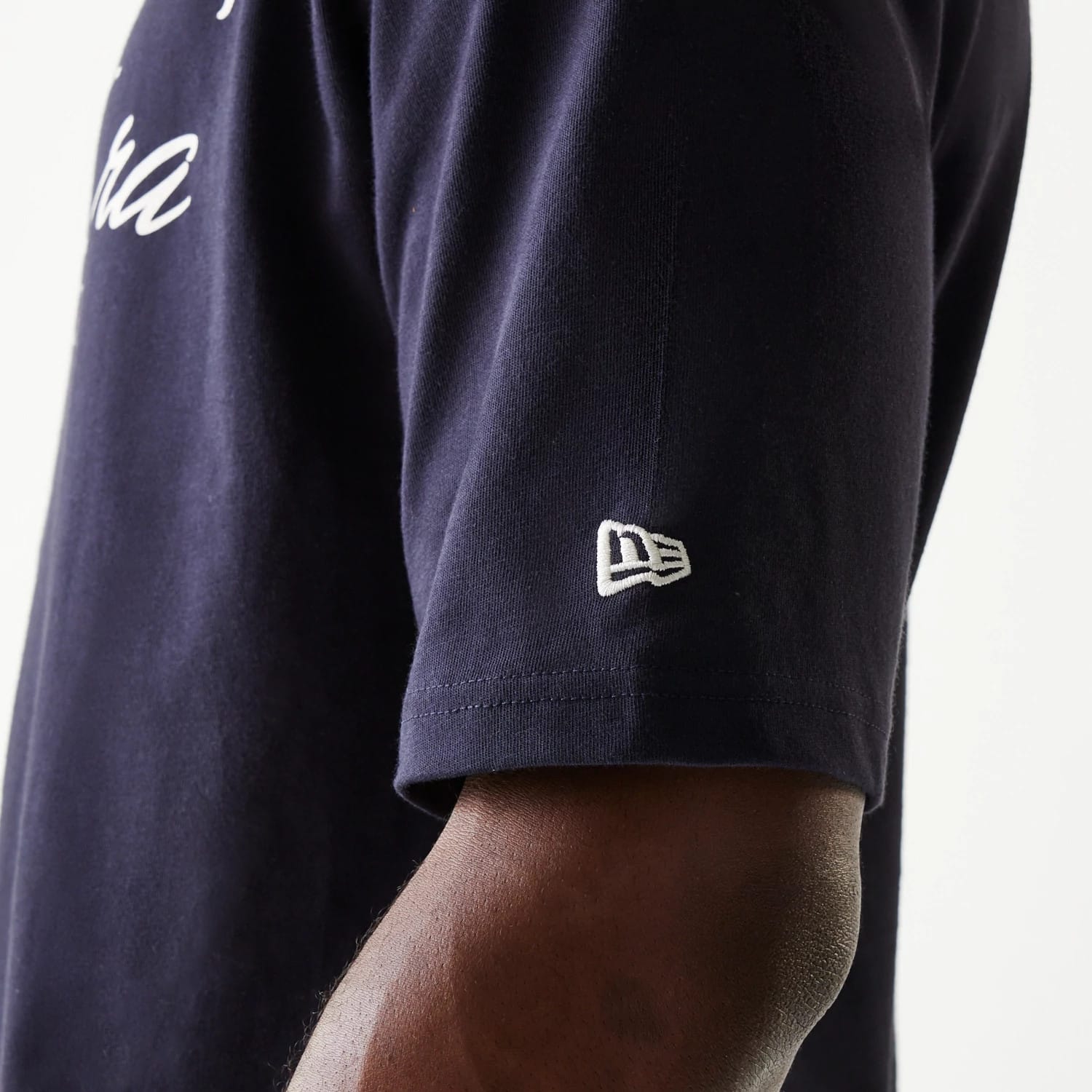 The Male model is wearing New Era Navy Oversized T-Shirt 5