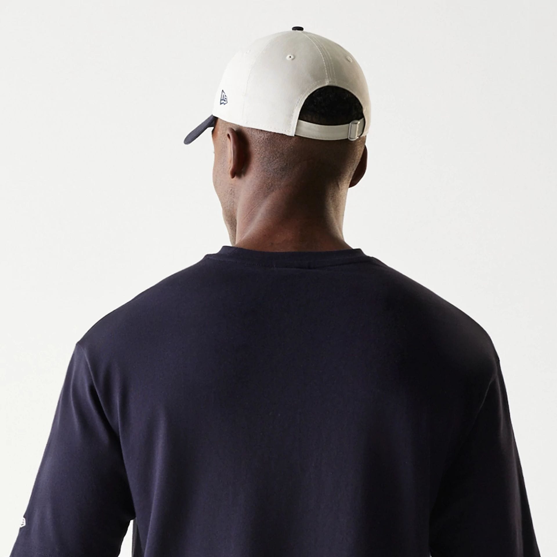 The Male model is wearing New Era Navy Oversized T-Shirt 7