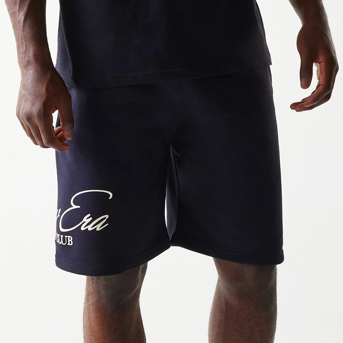 The Male model is wearing New Era Side Logo Navy Shorts 3