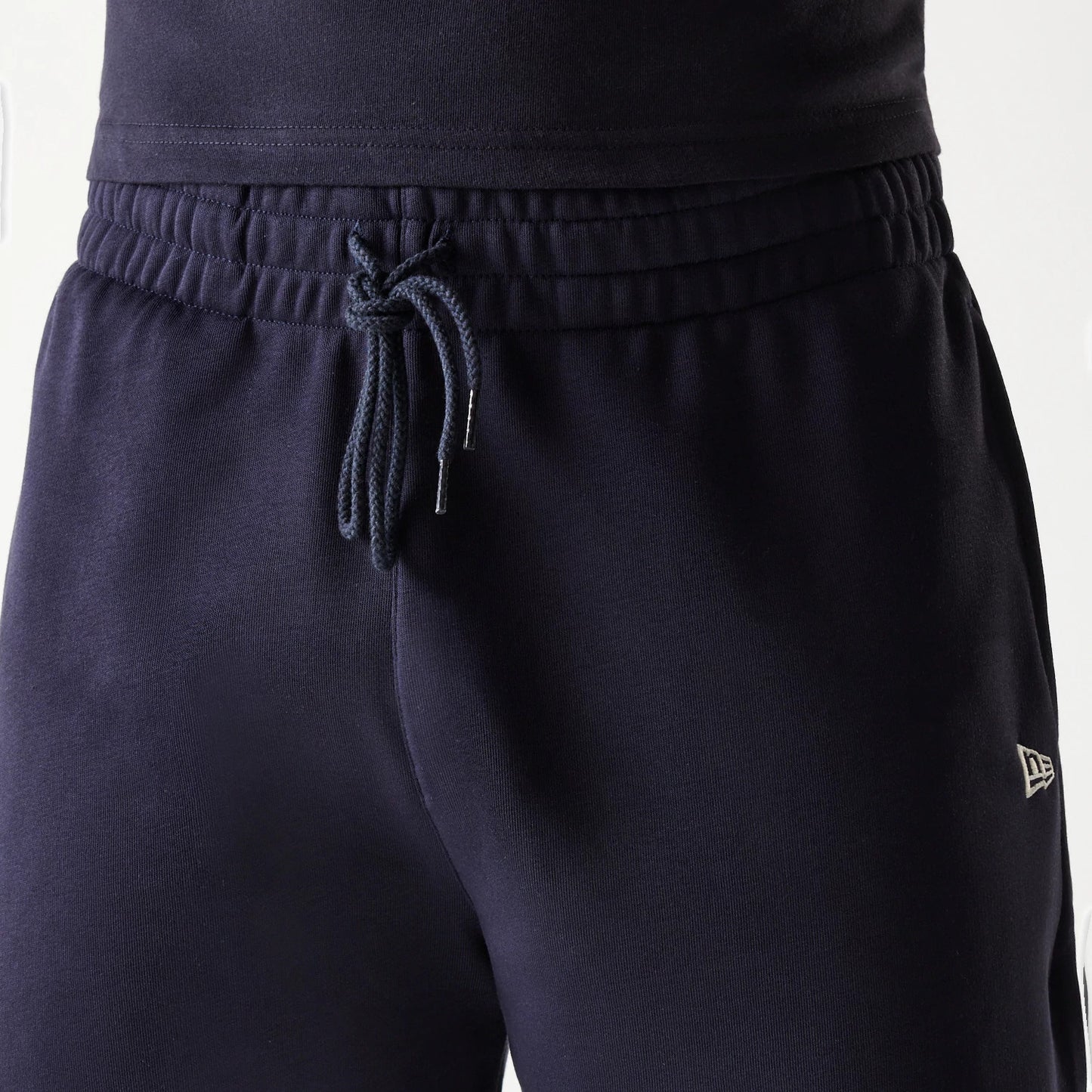 The Male model is wearing New Era Side Logo Navy Shorts 7