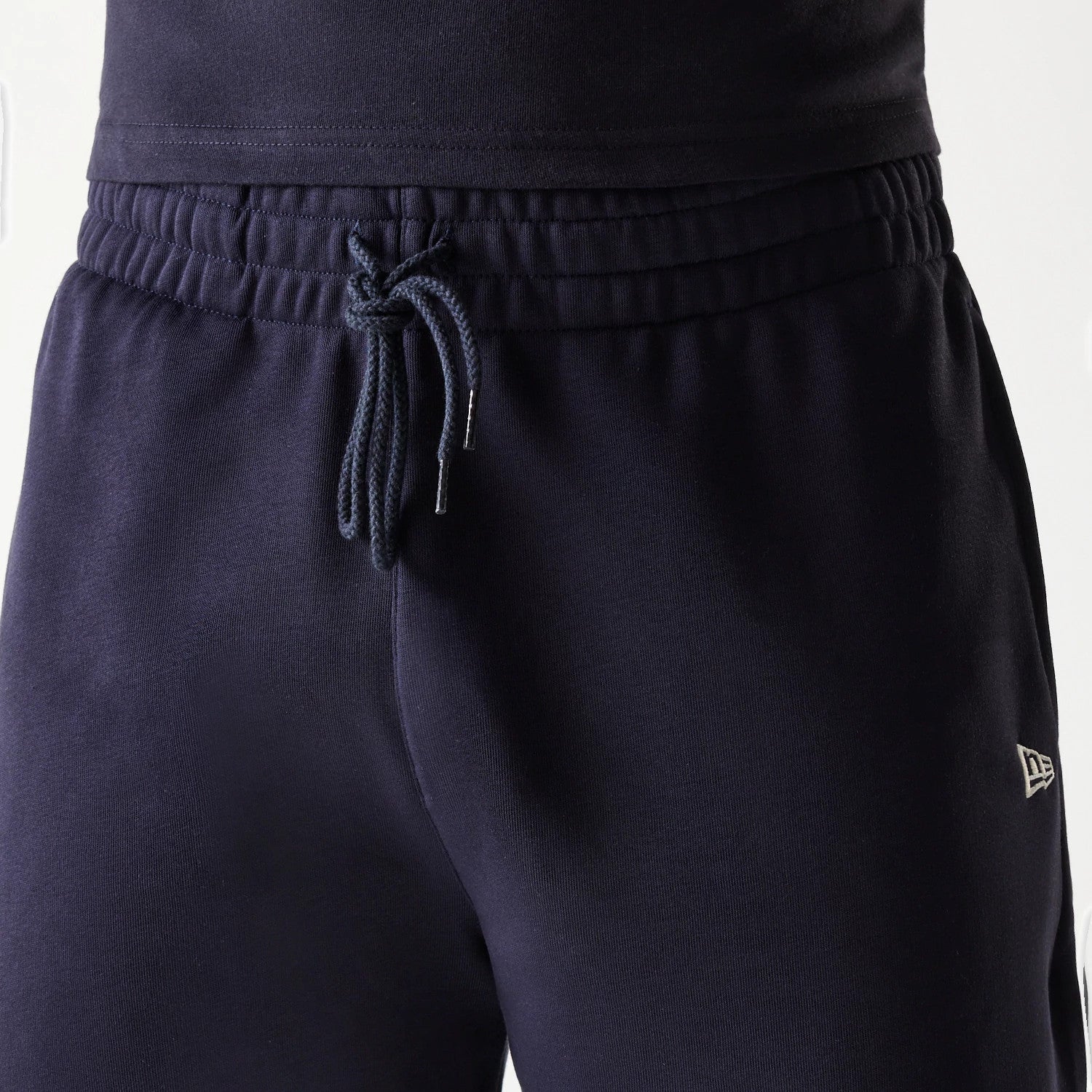 The Male model is wearing New Era Side Logo Navy Shorts 7