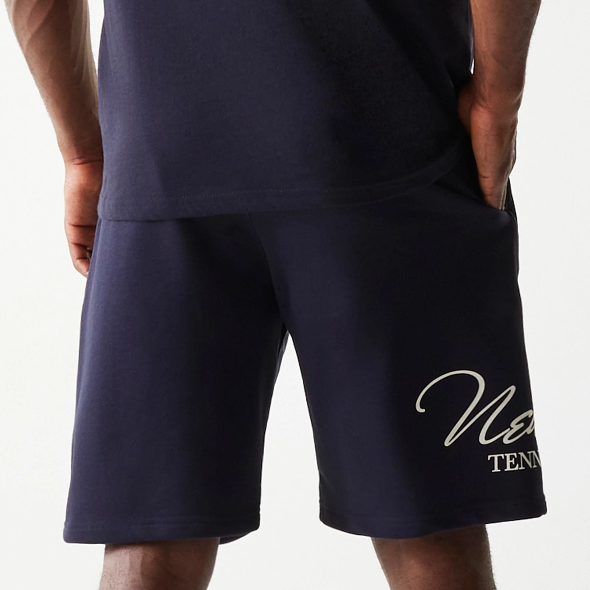 The Male model is wearing New Era Side Logo Navy Shorts 5