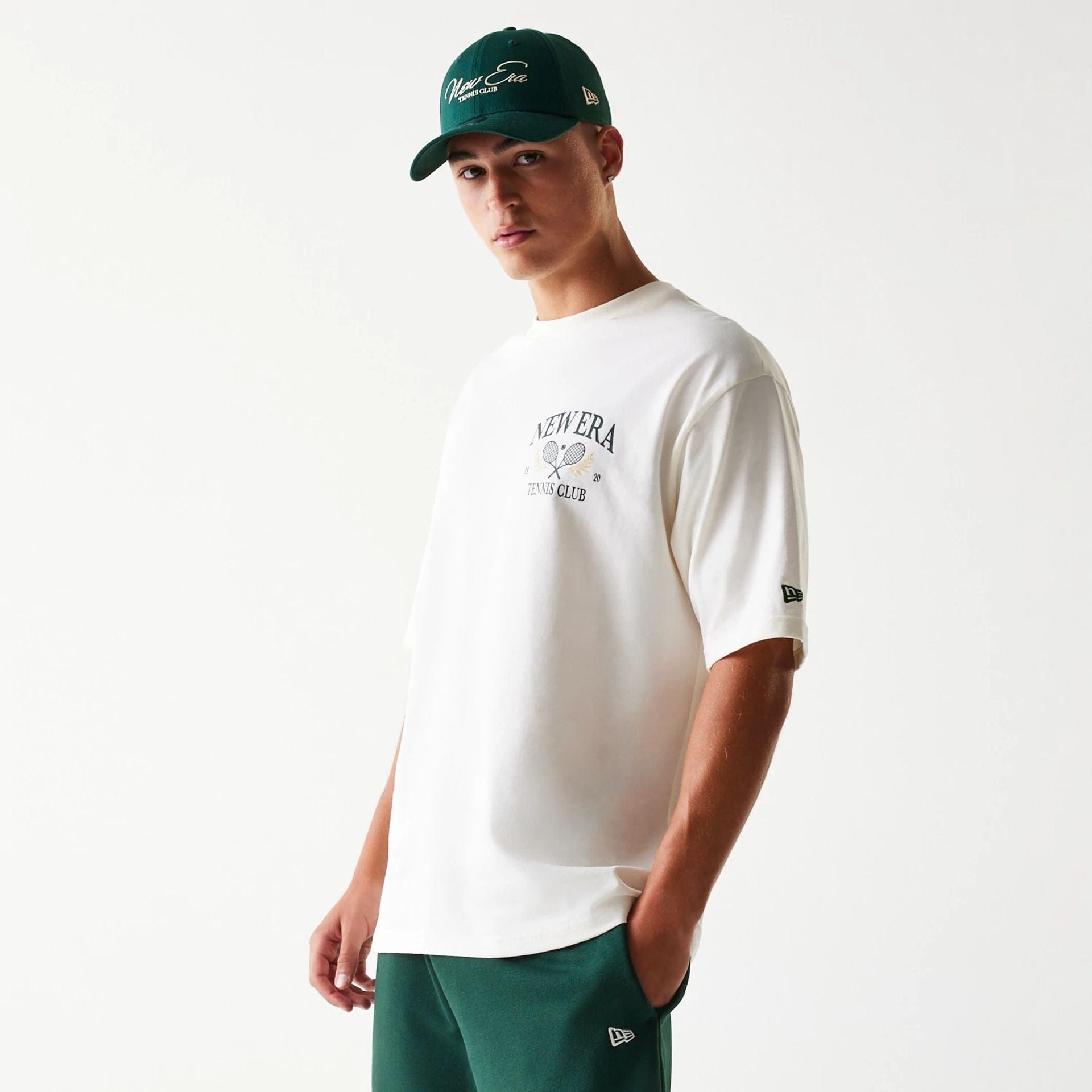 The Male model is wearing New Era Open White Oversized T-Shirt 1