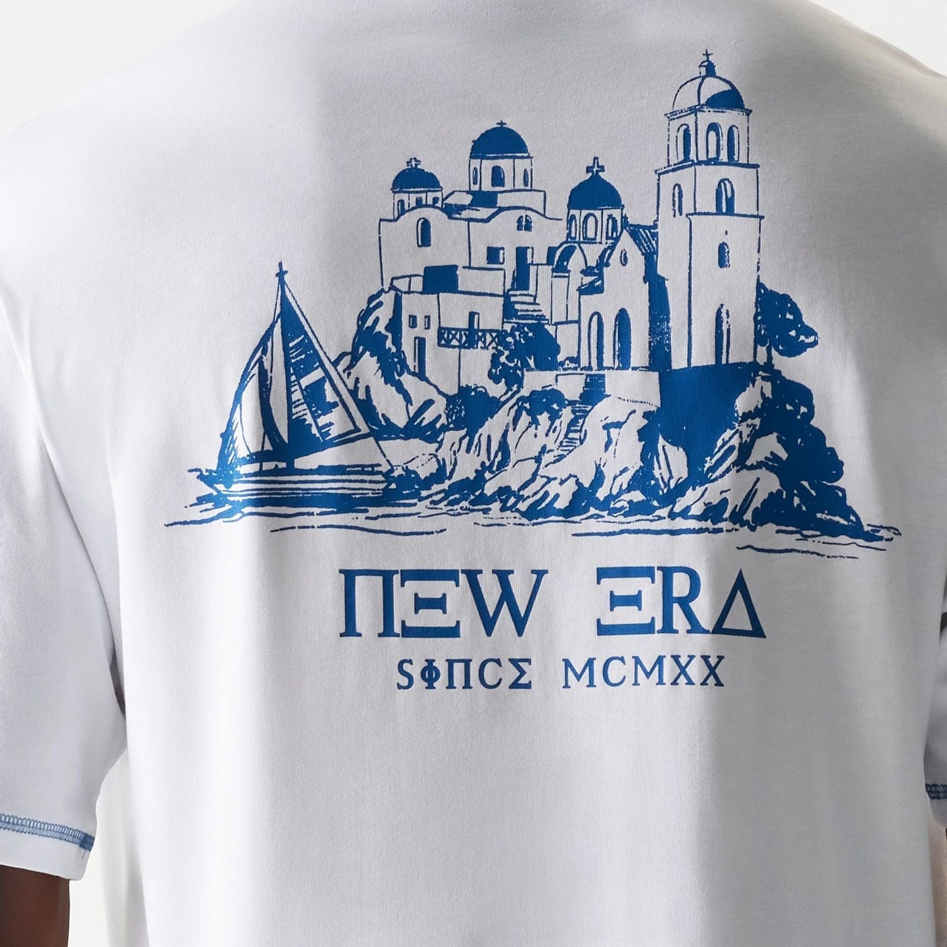 The Male model is wearing New Era Orthodox Church White Oversized T-Shirt 5