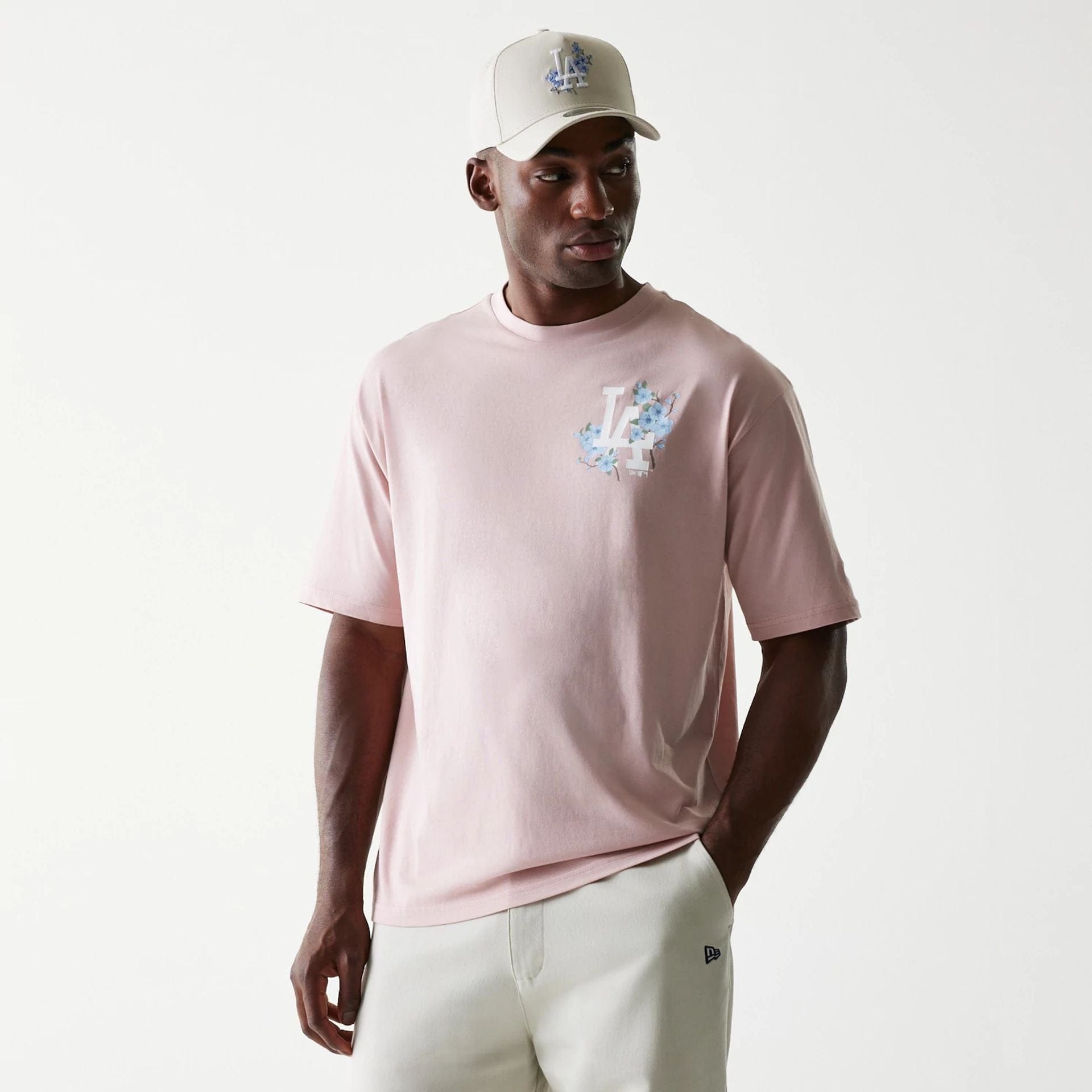 The Male model is wearing LA Dodgers MLB Floral Pastel Pink Oversized T-Shirt 1