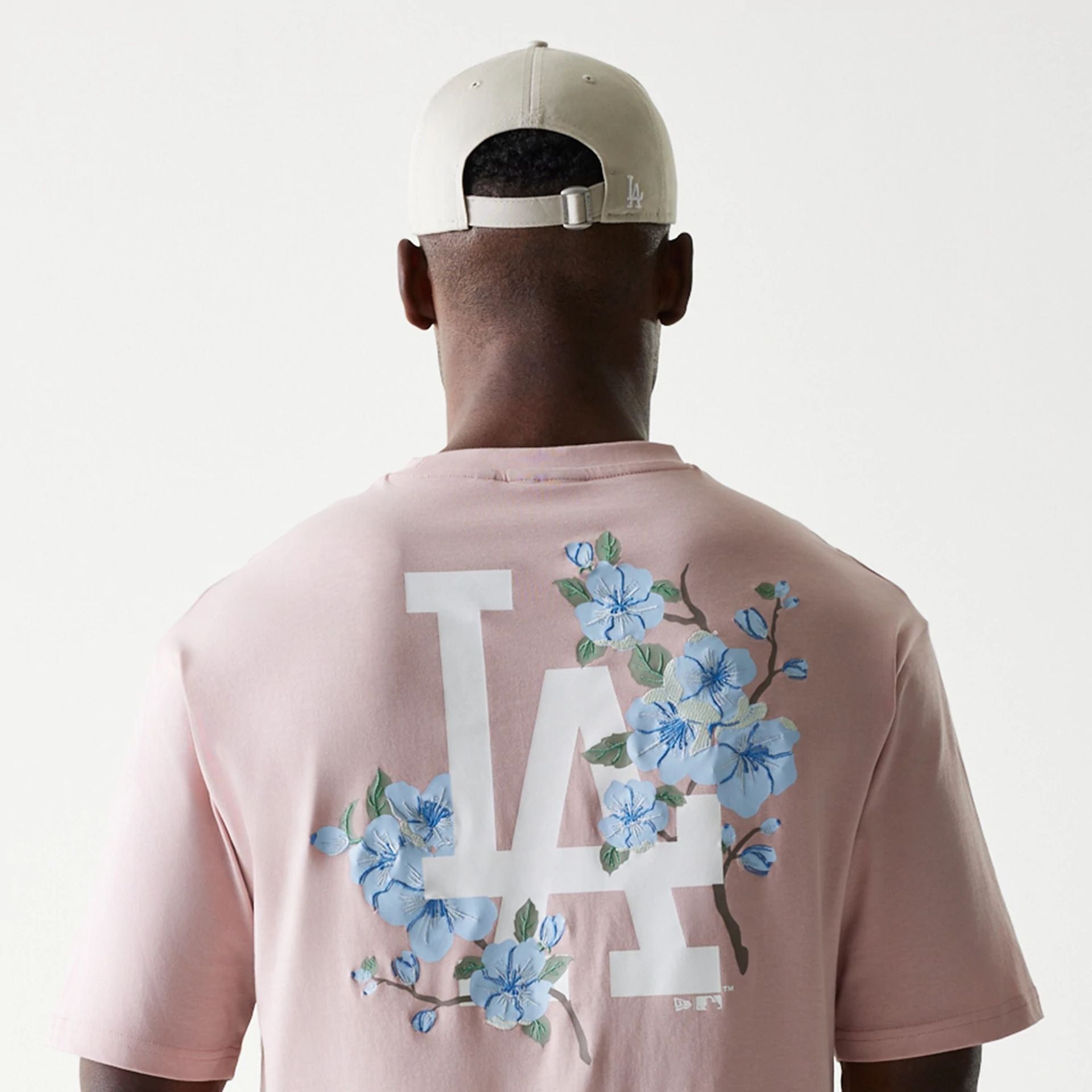 The Male model is wearing LA Dodgers MLB Floral Pastel Pink Oversized T-Shirt 6