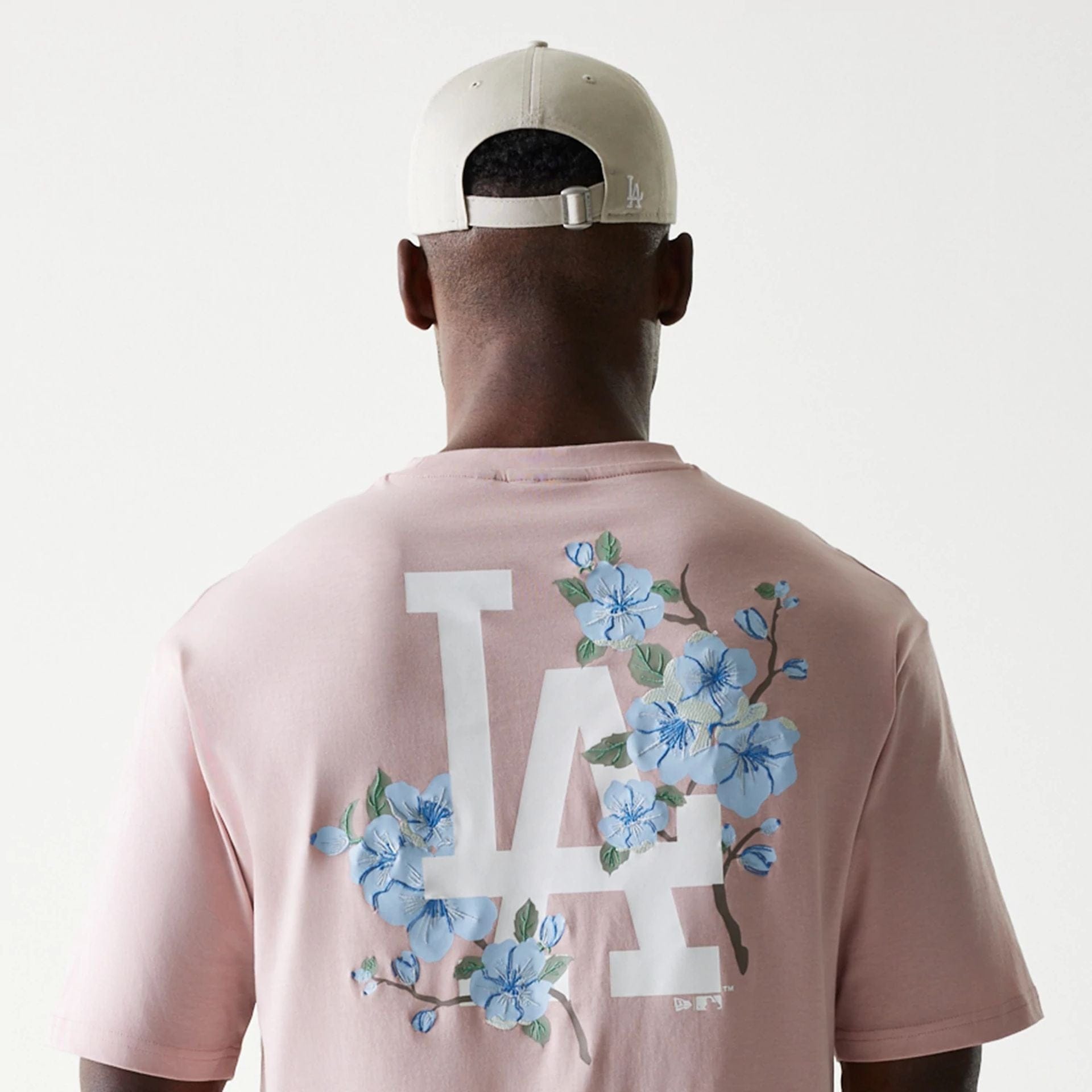 The Male model is wearing LA Dodgers MLB Floral Pastel Pink Oversized T-Shirt 6