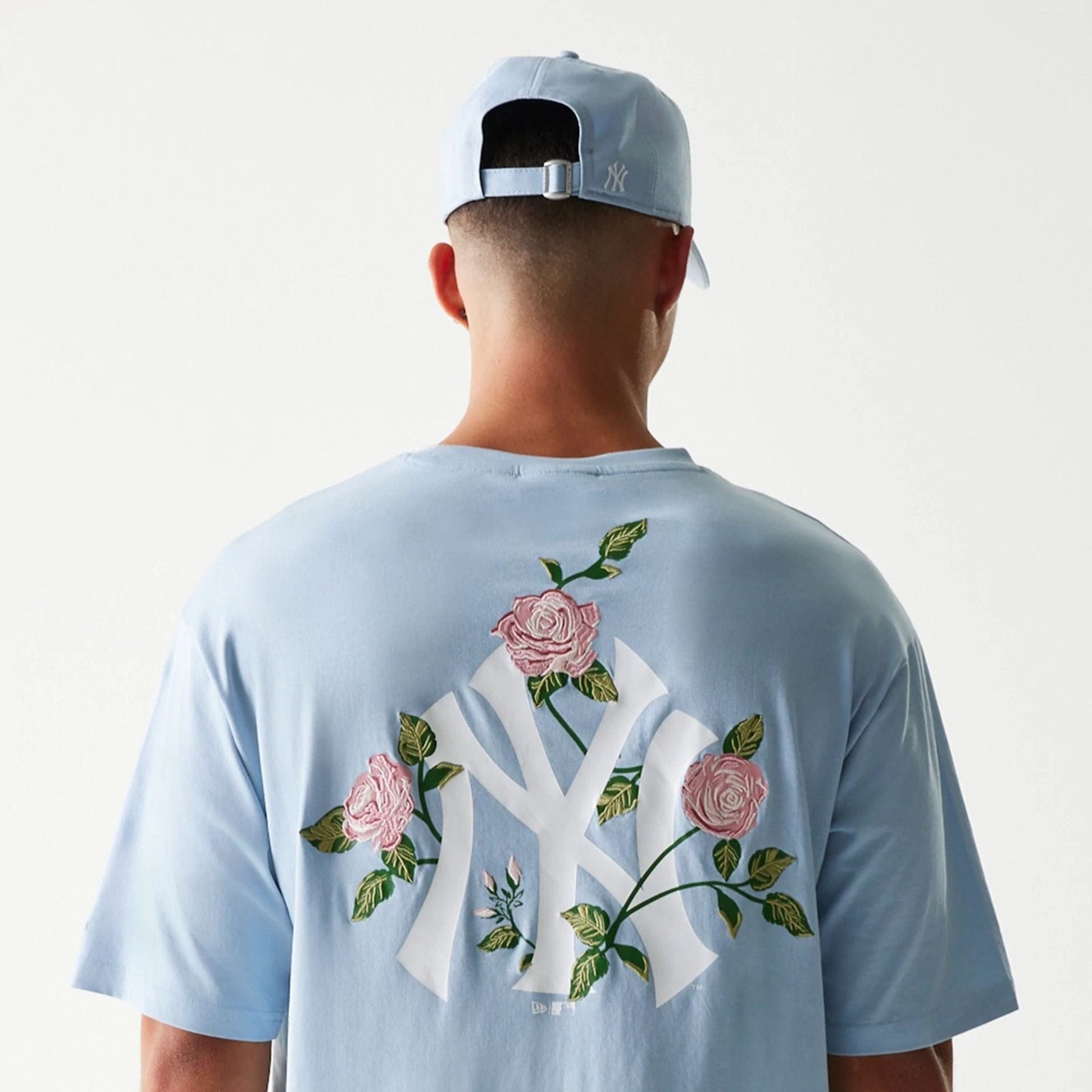 The Male model is wearing New York Yankees MLB Floral Pastel Blue Oversized T-Shirt 7