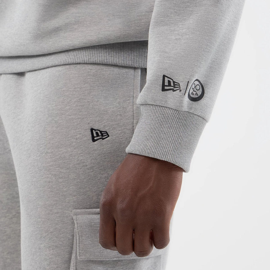 The Male model is wearing Sakamoto Days Netflix Grey Crew Neck Sweater  4