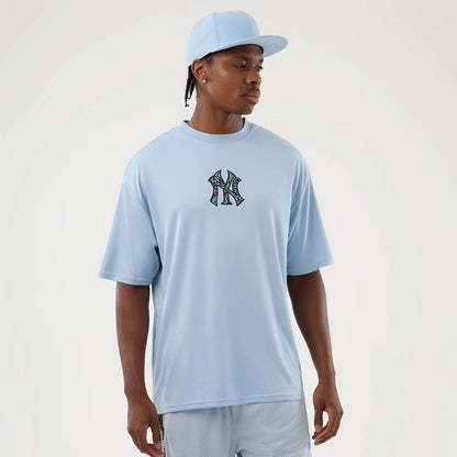 The Male model is wearing New York Yankees MLB Mesh Infill Pastel Blue Oversized T-Shirt 1