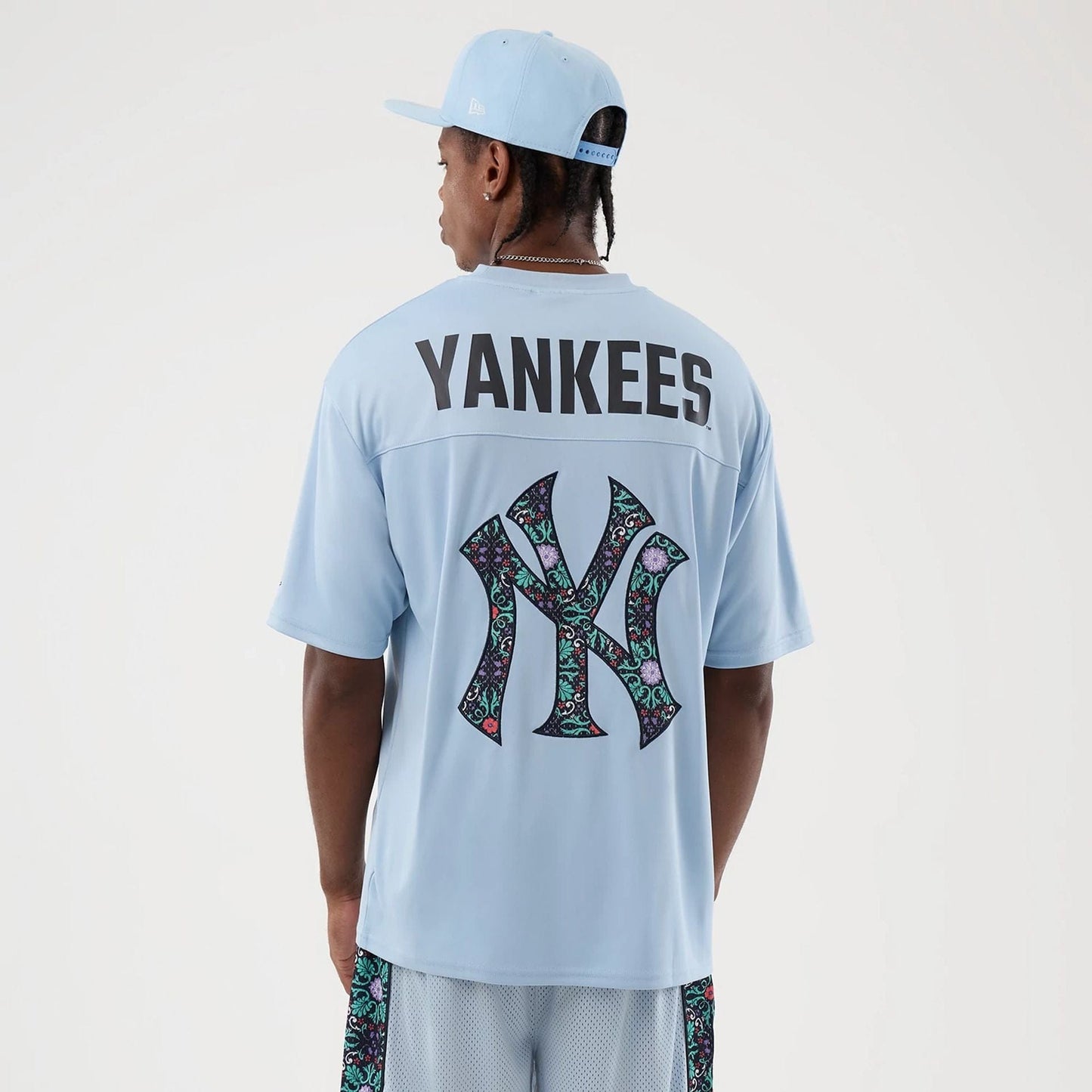 The Male model is wearing New York Yankees MLB Mesh Infill Pastel Blue Oversized T-Shirt 2