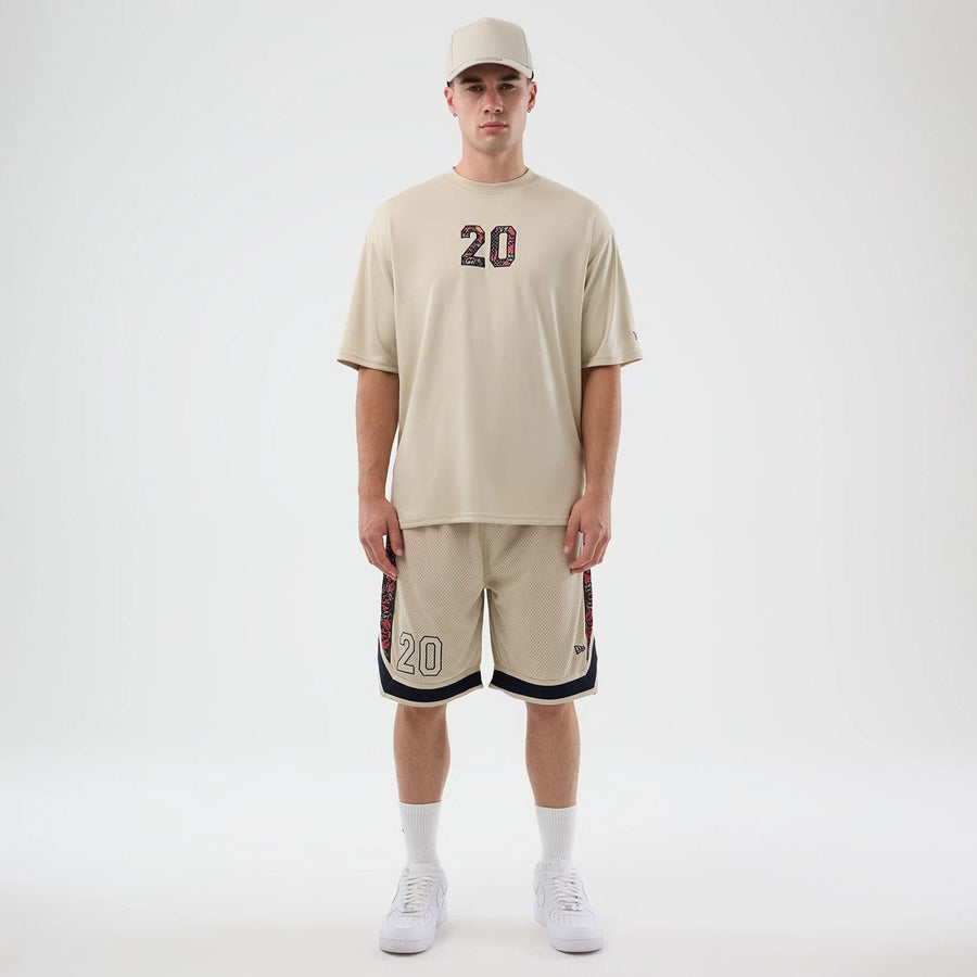 The Male model is wearing New Era Mesh Light Beige Mesh Shorts 8
