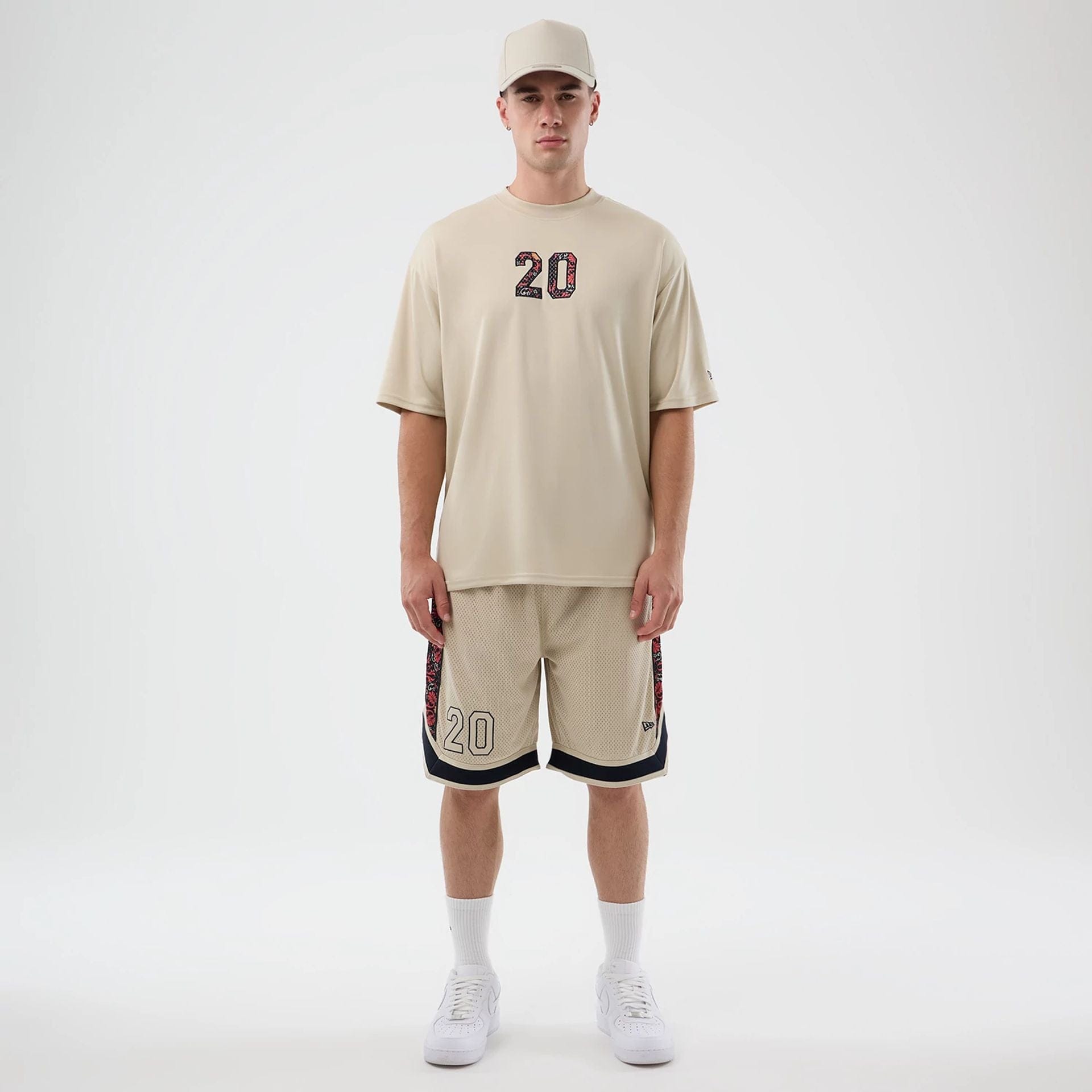 The Male model is wearing New Era Mesh Light Beige Mesh Shorts 8