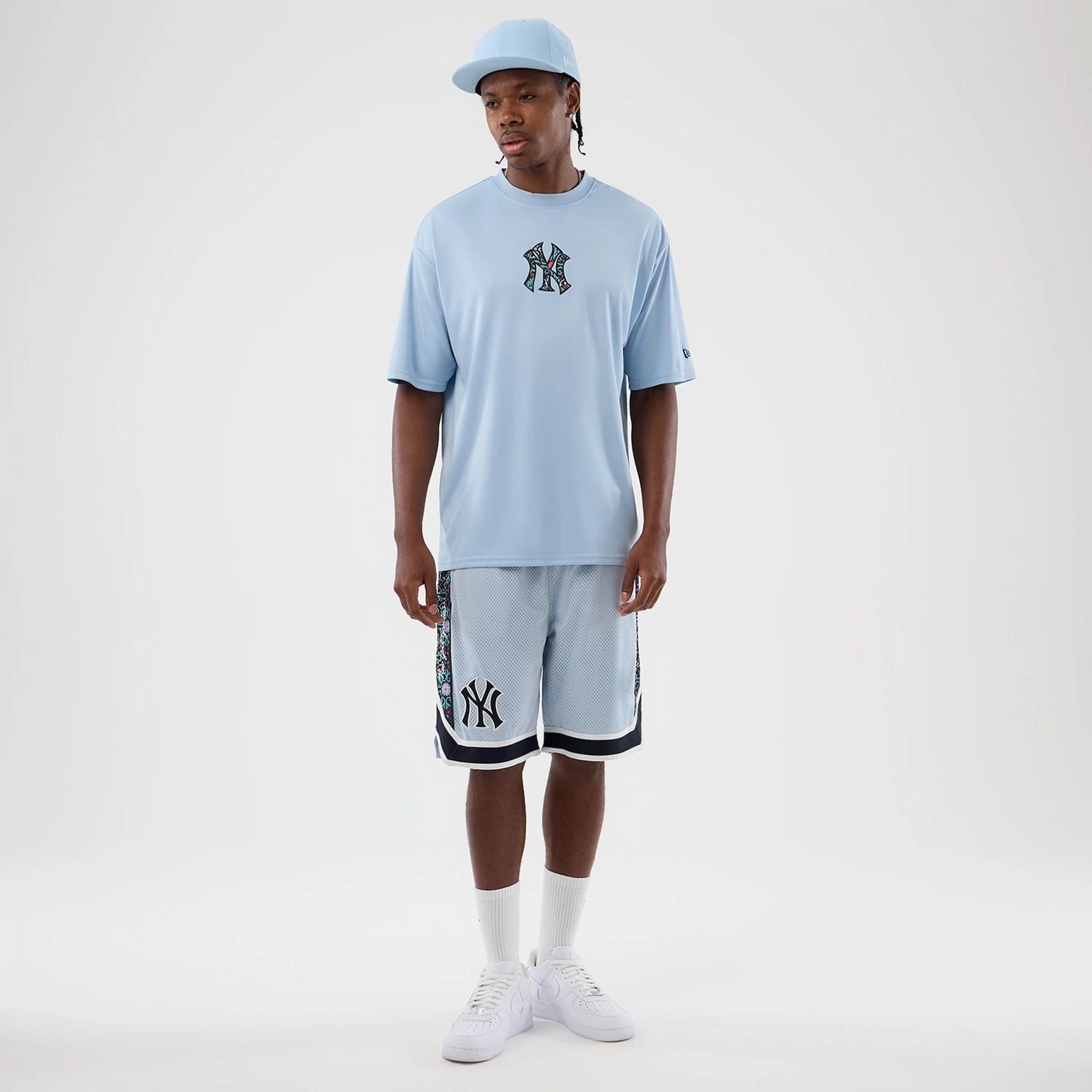 The Male model is wearing New York Yankees MLB Mesh Pastel Blue Mesh Shorts 3