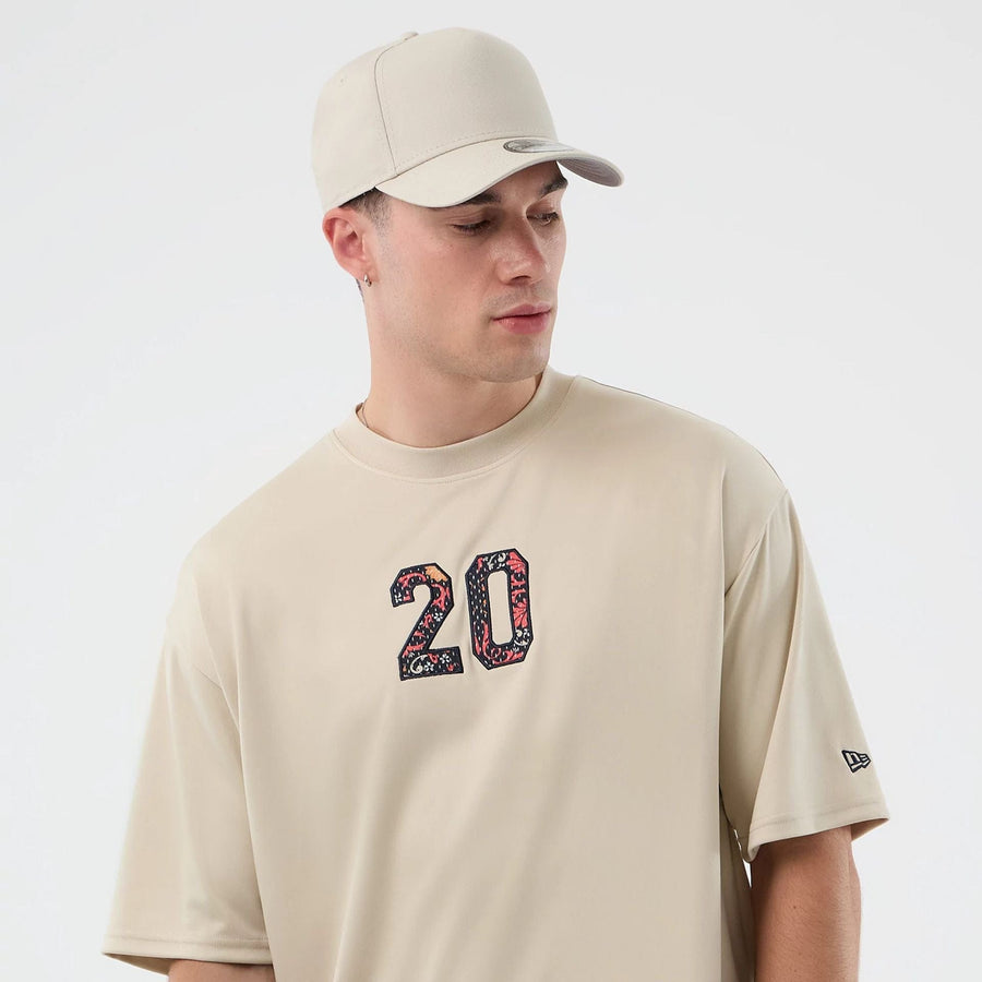 The Male model is wearing New Era Mesh Infill Light Beige Oversized T-Shirt 6