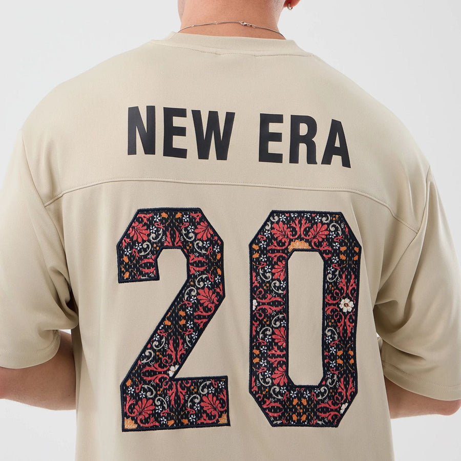 The Male model is wearing New Era Mesh Infill Light Beige Oversized T-Shirt 7