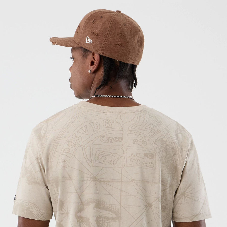 The model is wearing this Treasure Map The Goonies T-Shirt in light beige. 6