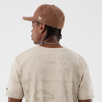 The model is wearing this Treasure Map The Goonies T-Shirt in light beige. 6