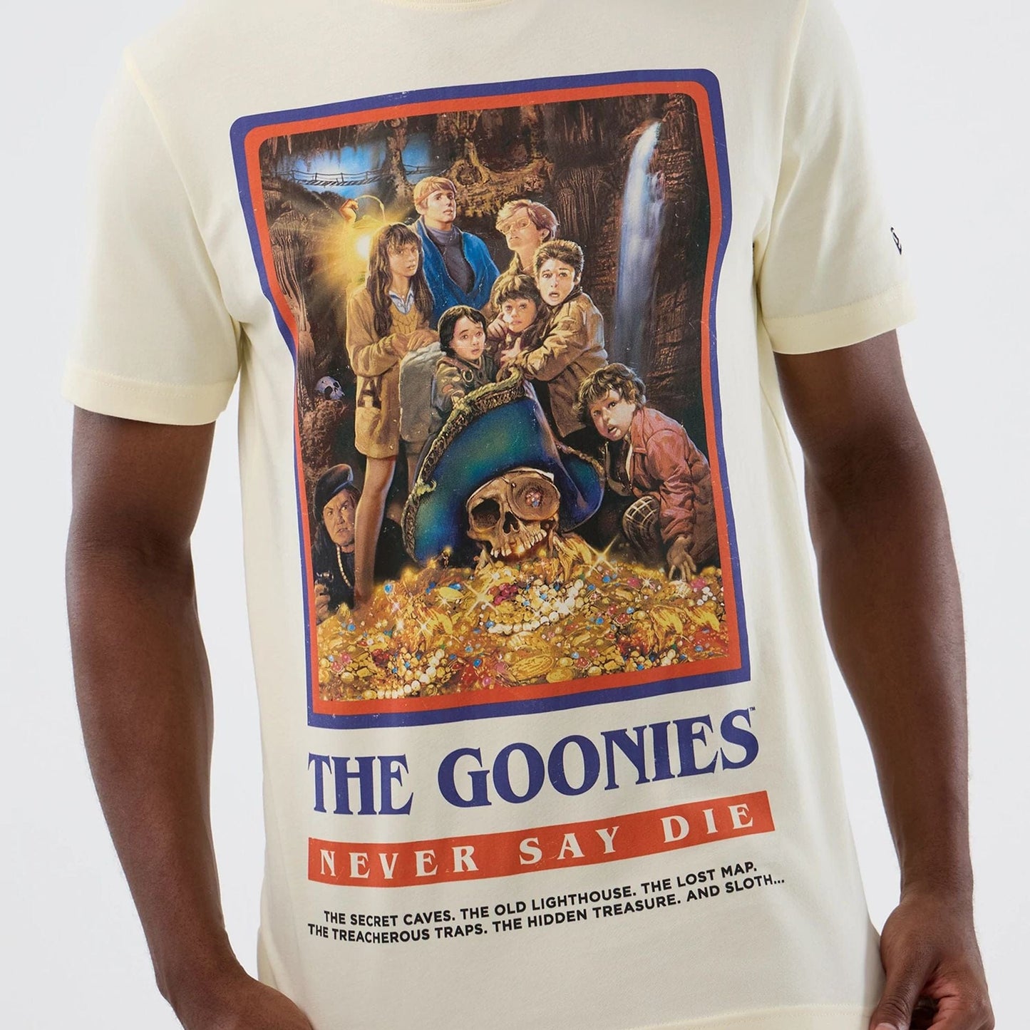 The model is wearing this Movie Poster The Goonies T-Shirt in Cream. 3
