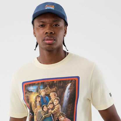 The model is wearing this Movie Poster The Goonies T-Shirt in Cream. 5