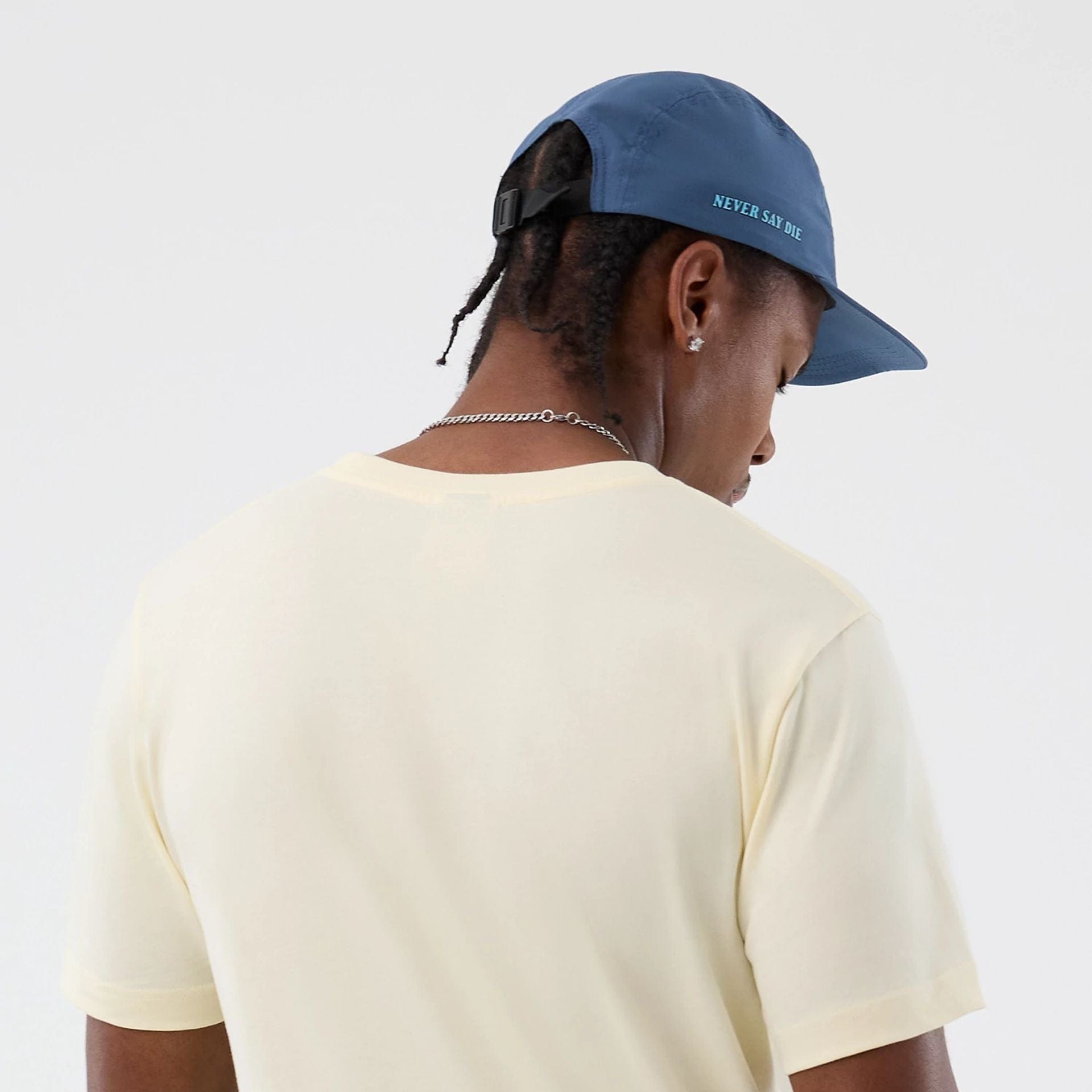 The model is wearing this Movie Poster The Goonies T-Shirt in Cream. 6