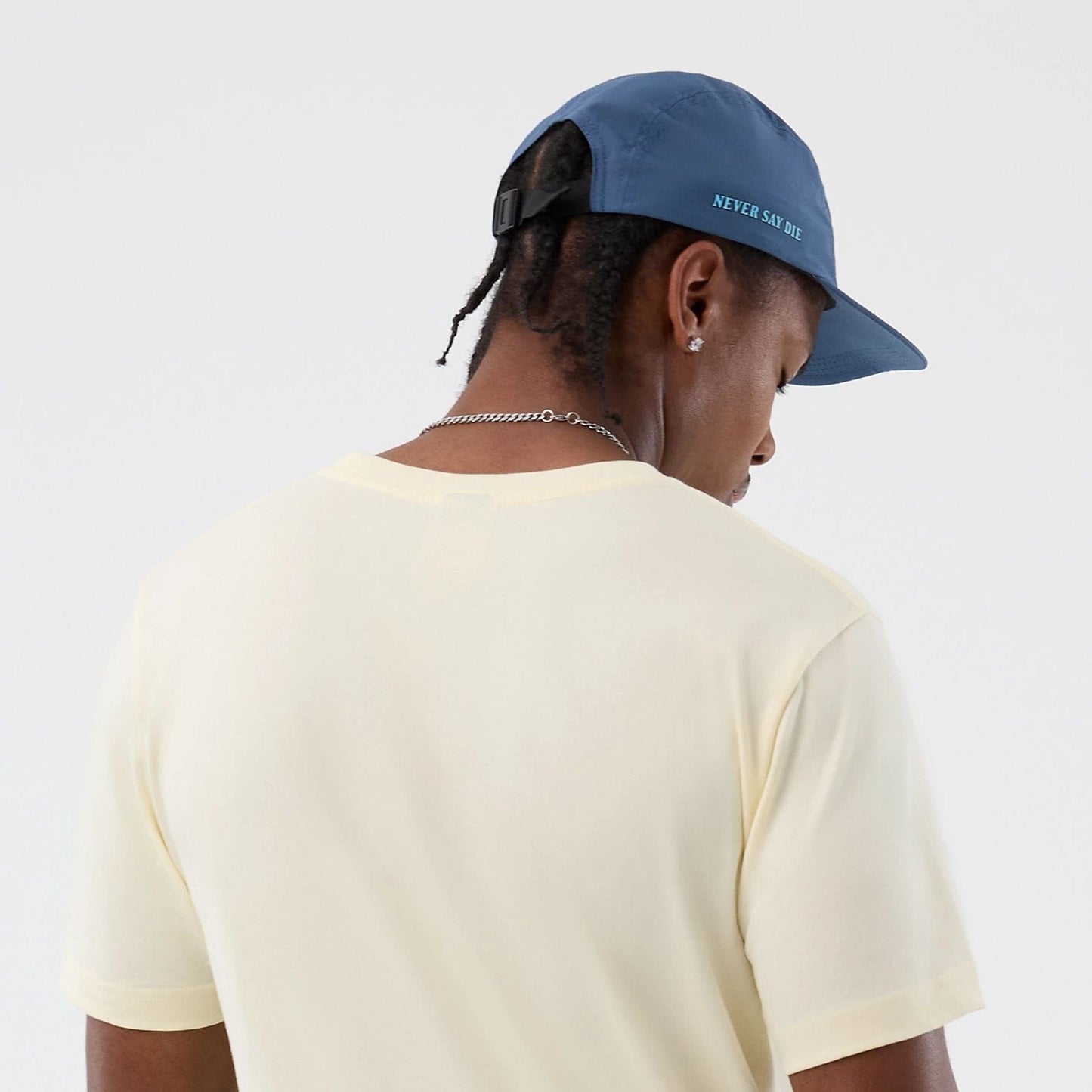 The model is wearing this Movie Poster The Goonies T-Shirt in Cream. 6