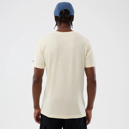 The model is wearing this Movie Poster The Goonies T-Shirt in Cream. 2