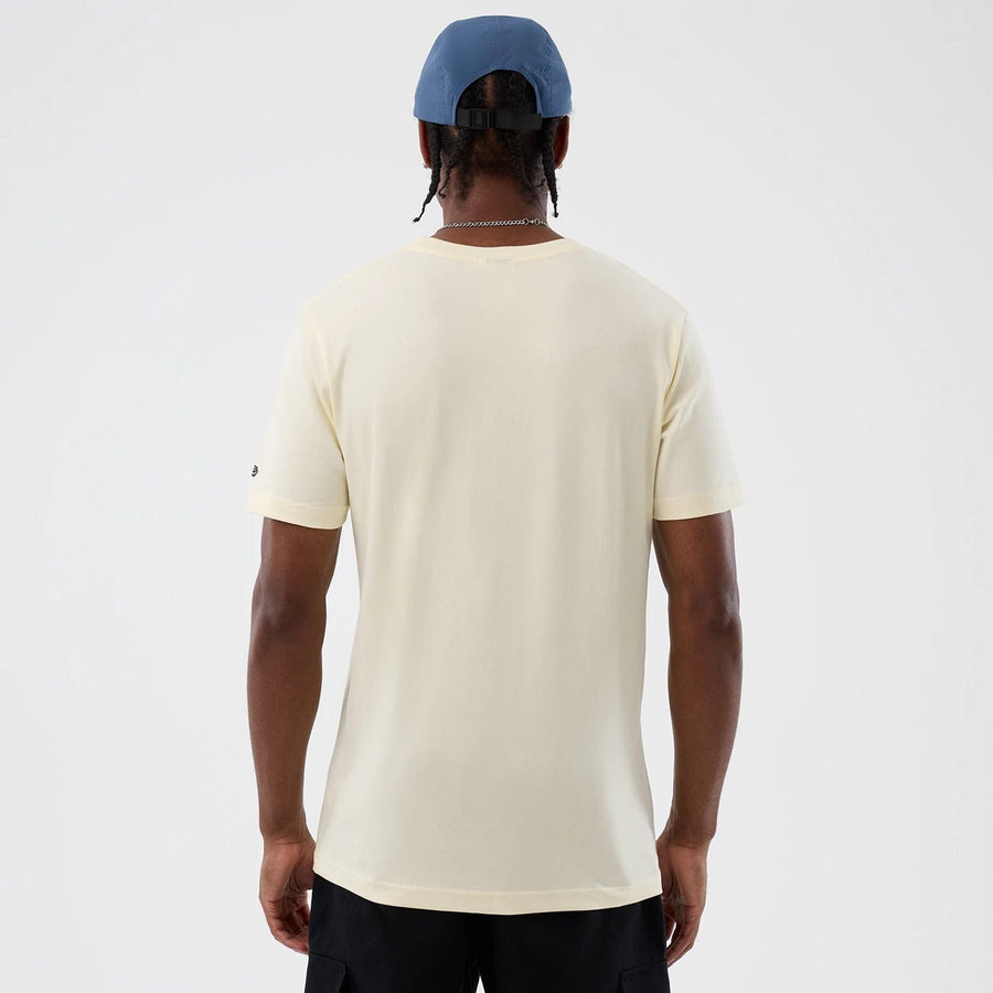 The model is wearing this Movie Poster The Goonies T-Shirt in Cream. 2