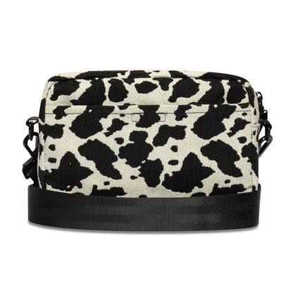 Pictured is this New Era Cow Jacquard Waist Bag in light beige. 4