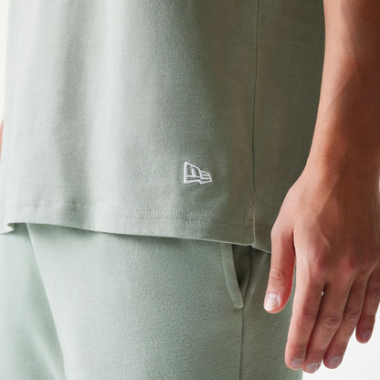 The model is wearing this MLB League Essential LA Dodgers Sleeveless T-Shirt in pastel green. 6