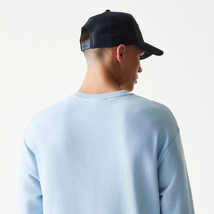 The model is wearing this MLB League Essential Midi New York Yankees Oversized Crew Neck Sweater in pastel blue. 7