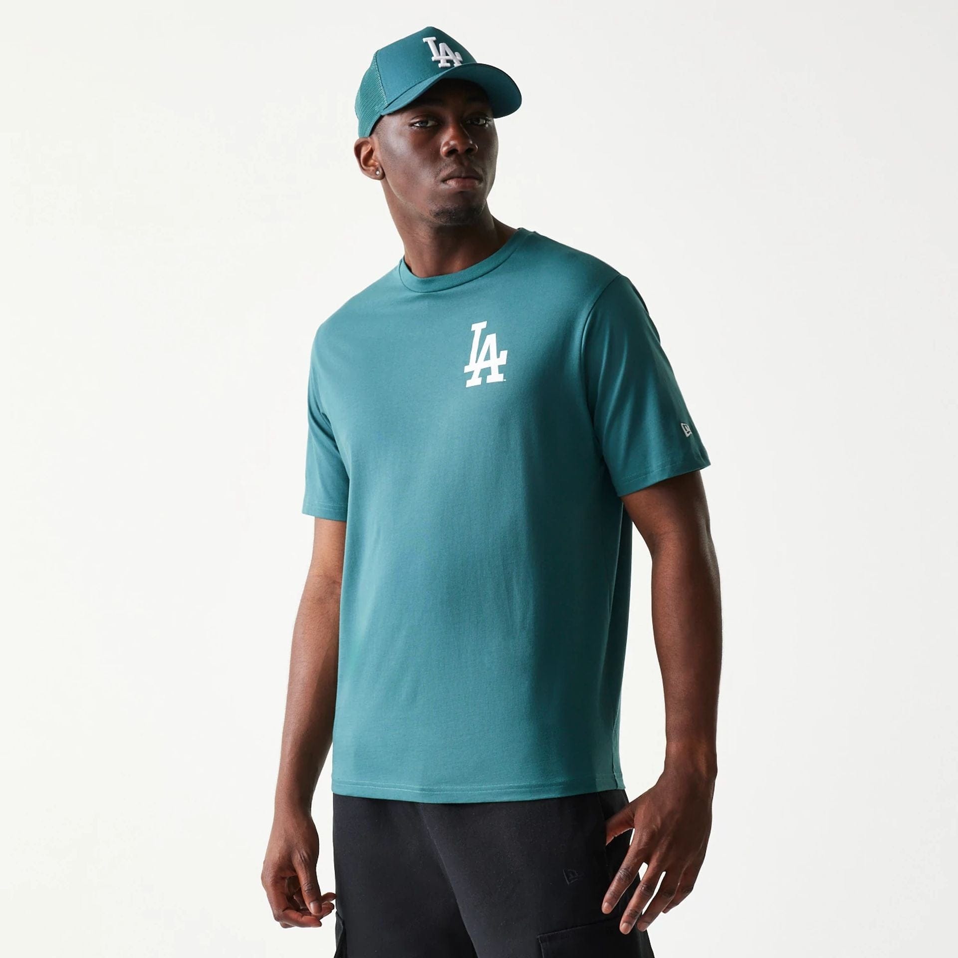 The model is wearing this MLB Food Graphic LA Dodgers T-Shirt in dark green. 1
