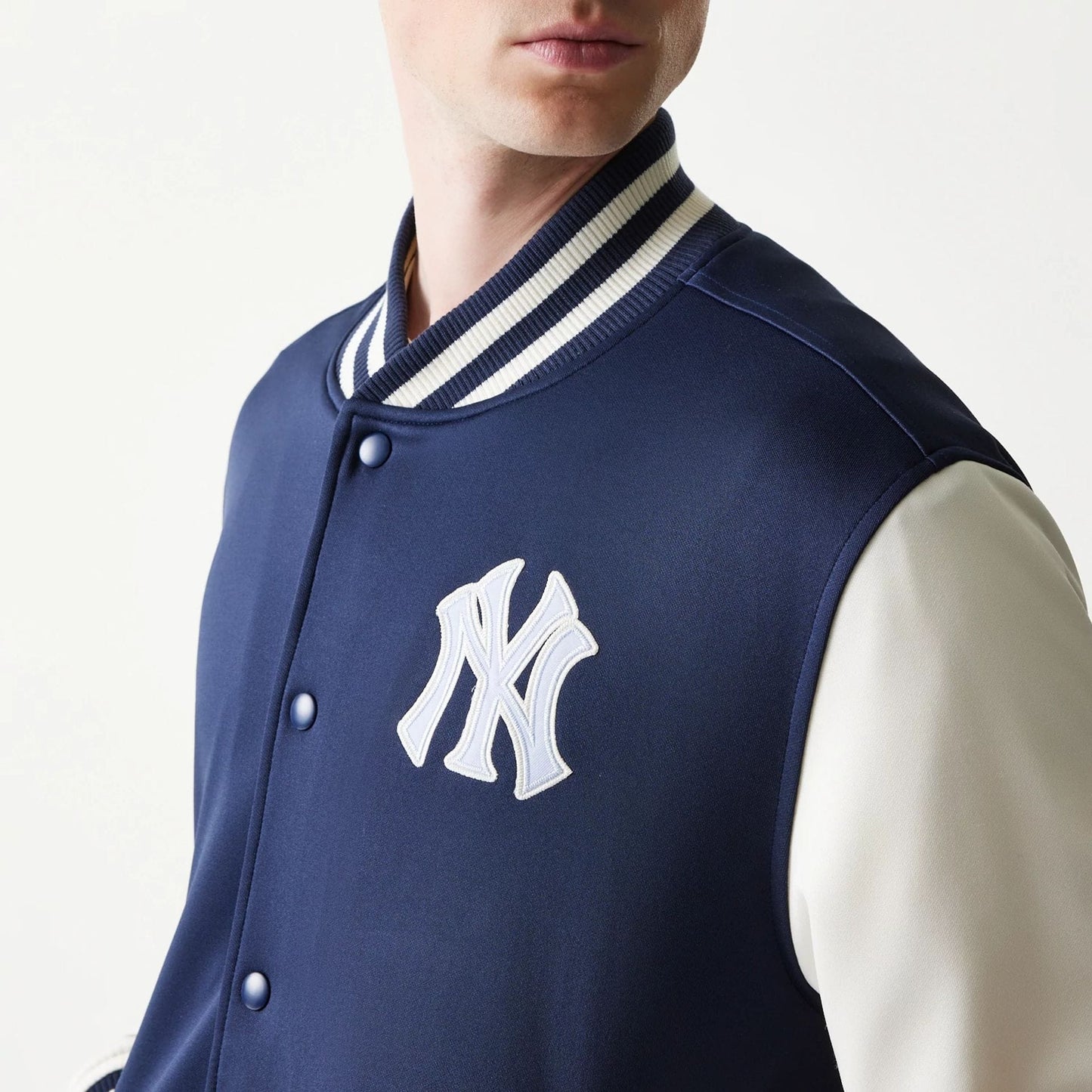 The model is wearing this MLB New York Yankees Bomber Jacket in navy. 8