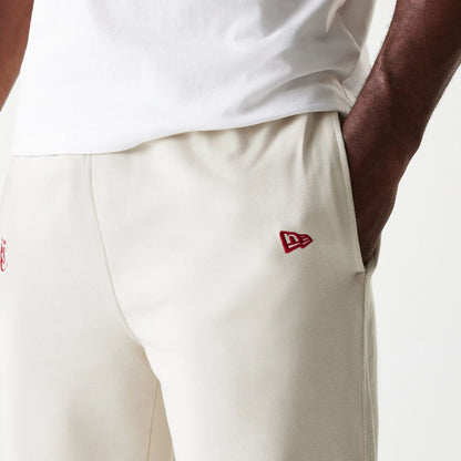 The model is wearing this NBA League Essential LA Lakers Joggers in cream. 5