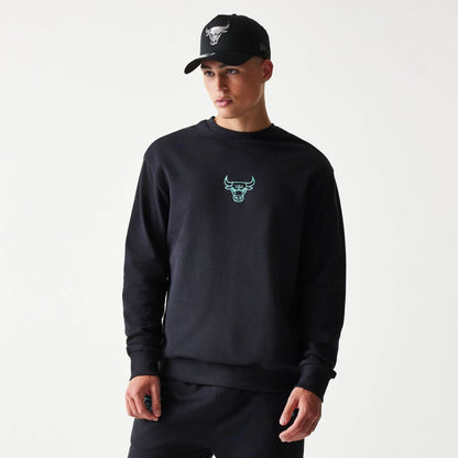 The model is wearing this NBA League Essential Chicago Bulls Oversized Crew Neck Sweater in black. 1
