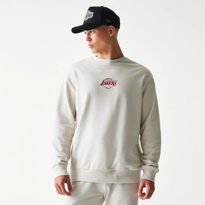 The model is wearing this NBA League Essential LA Lakers Oversized Crew Neck Sweater in cream. 1