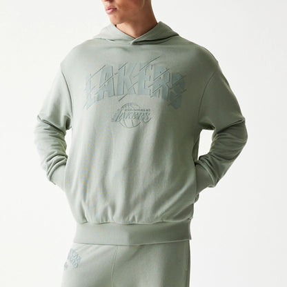 The model is wearing this NBA LA Lakers Oversized Pullover Hoodie in pastel green. 3
