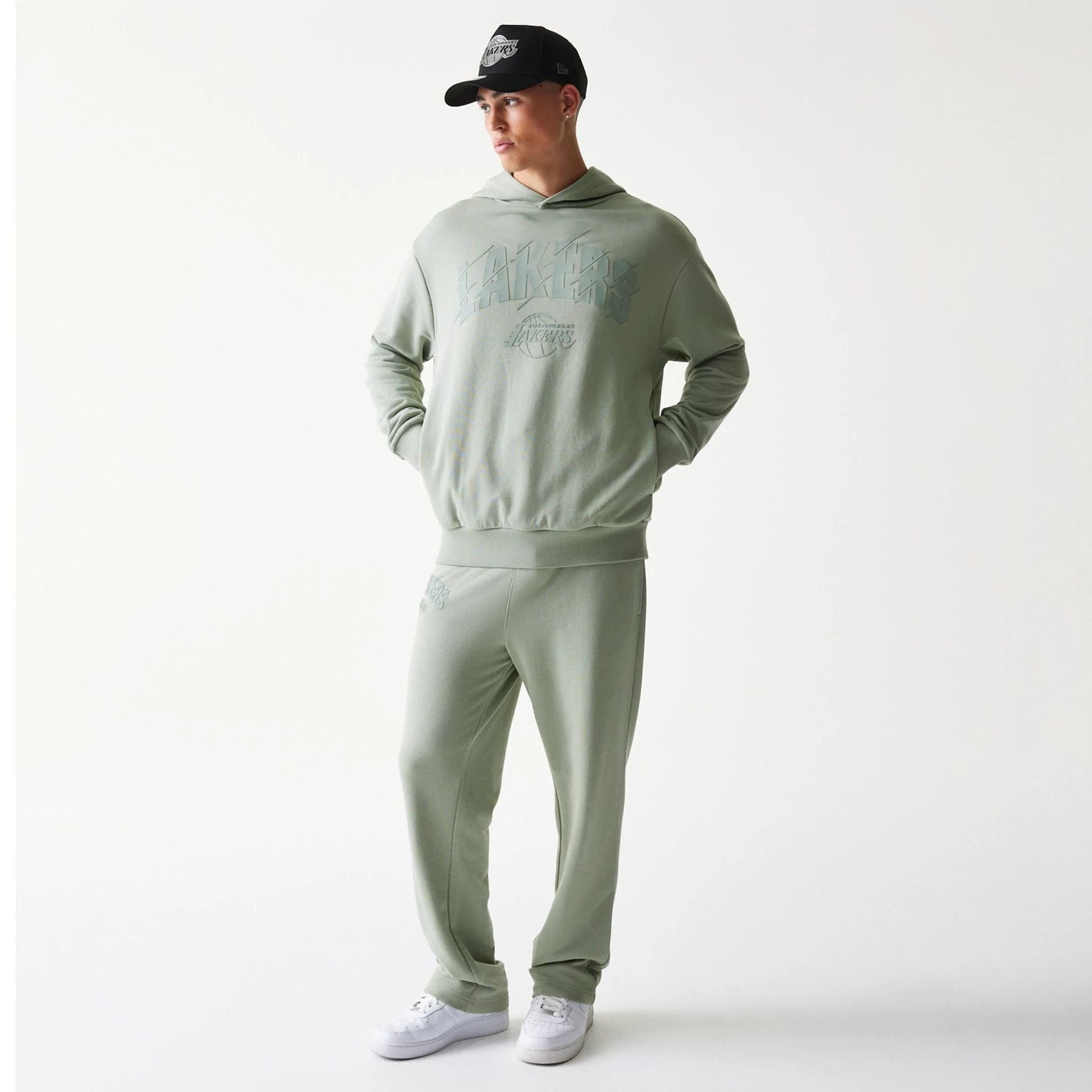 The model is wearing this NBA LA Lakers Oversized Pullover Hoodie in pastel green. 8