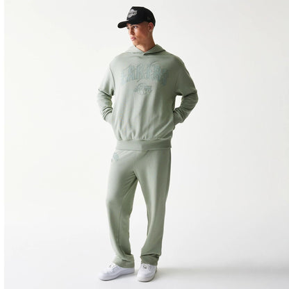 The model is wearing this NBA LA Lakers Oversized Pullover Hoodie in pastel green. 8