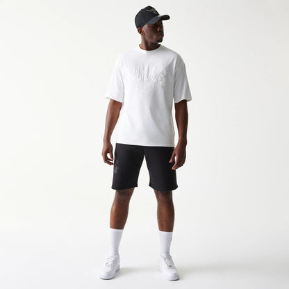 The model is wearing this NBA Chicago Bulls Oversized T-Shirt in white. 8