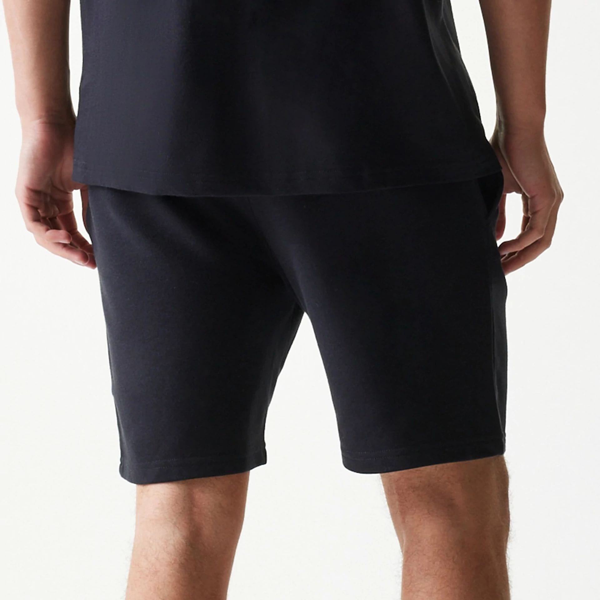 The model is wearing this NBA League Essential Chicago Bulls Shorts in black. 7