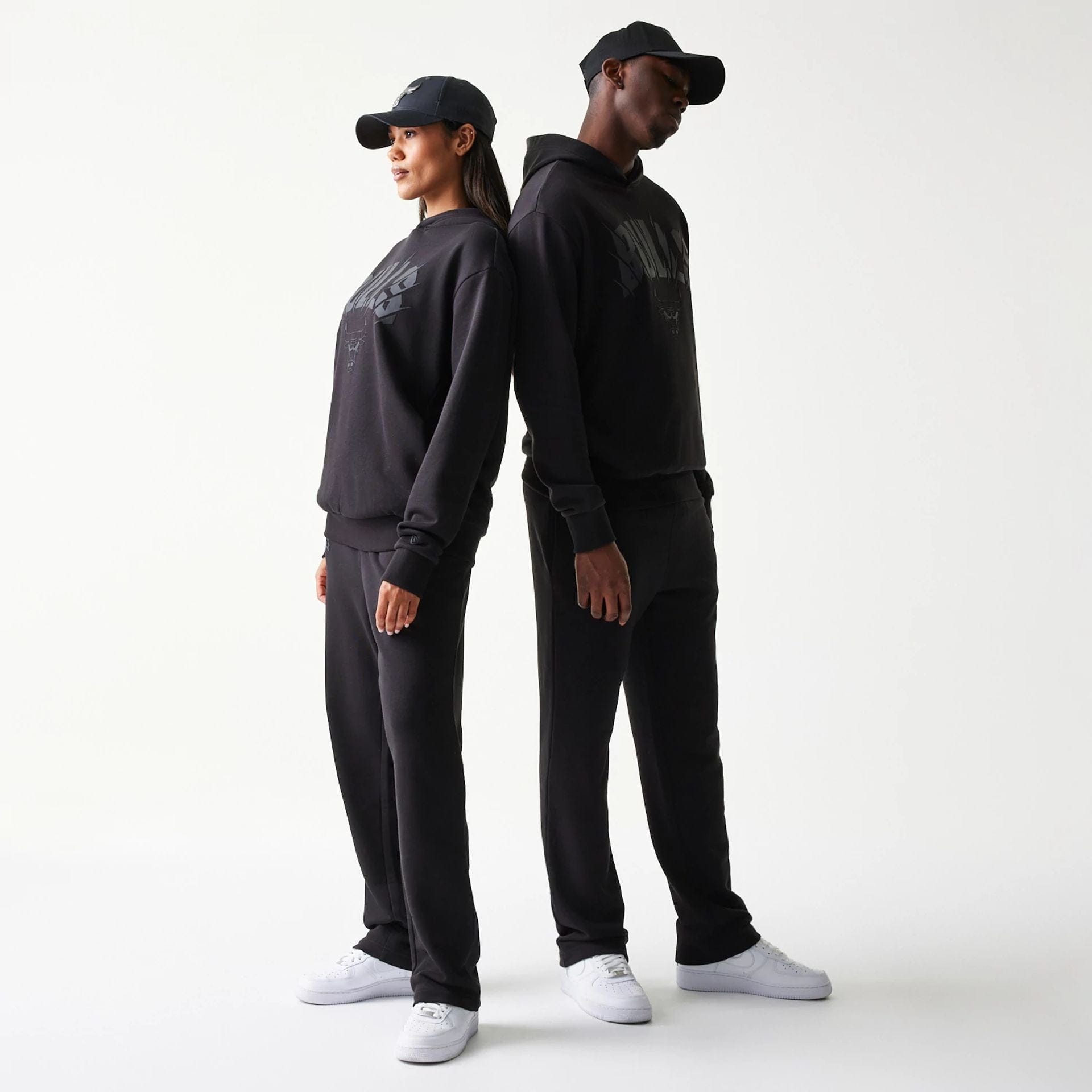 The model is wearing this NBA Chicago Bulls Oversized Pullover Hoodie in black. 1