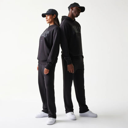 The model is wearing this NBA Chicago Bulls Oversized Pullover Hoodie in black. 1