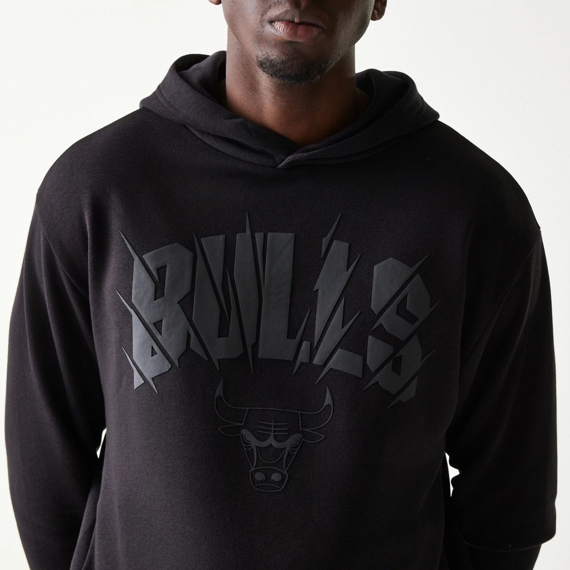 The model is wearing this NBA Chicago Bulls Oversized Pullover Hoodie in black. 6