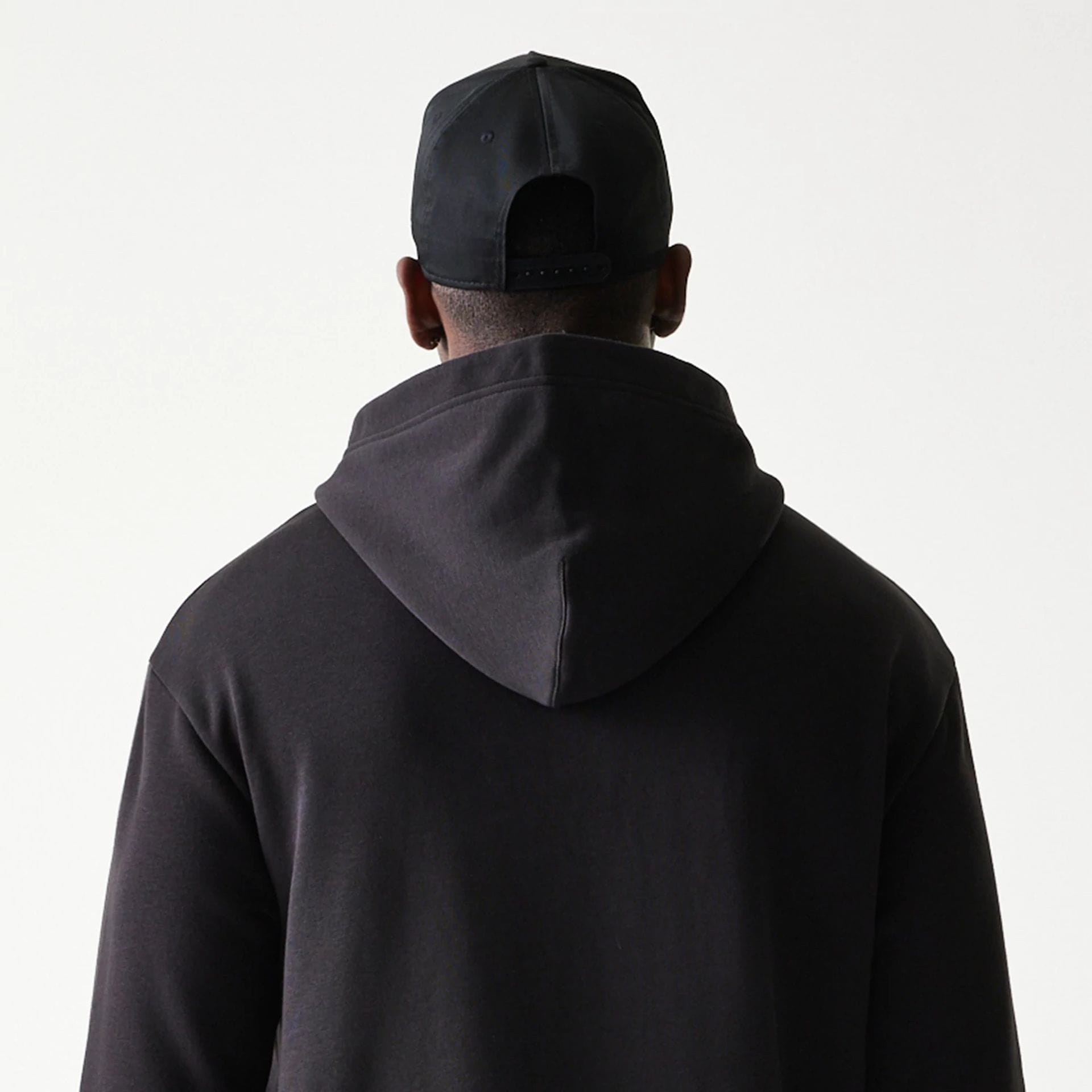 The model is wearing this NBA Chicago Bulls Oversized Pullover Hoodie in black. 8