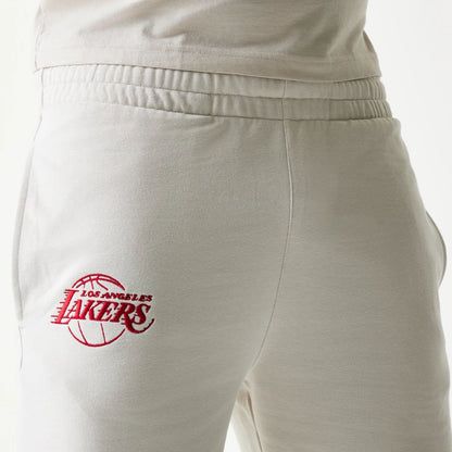 The model is wearing this NBA League Essential LA Lakers Shorts in cream. 5