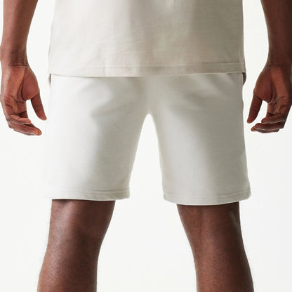 The model is wearing this NBA League Essential LA Lakers Shorts in cream. 6