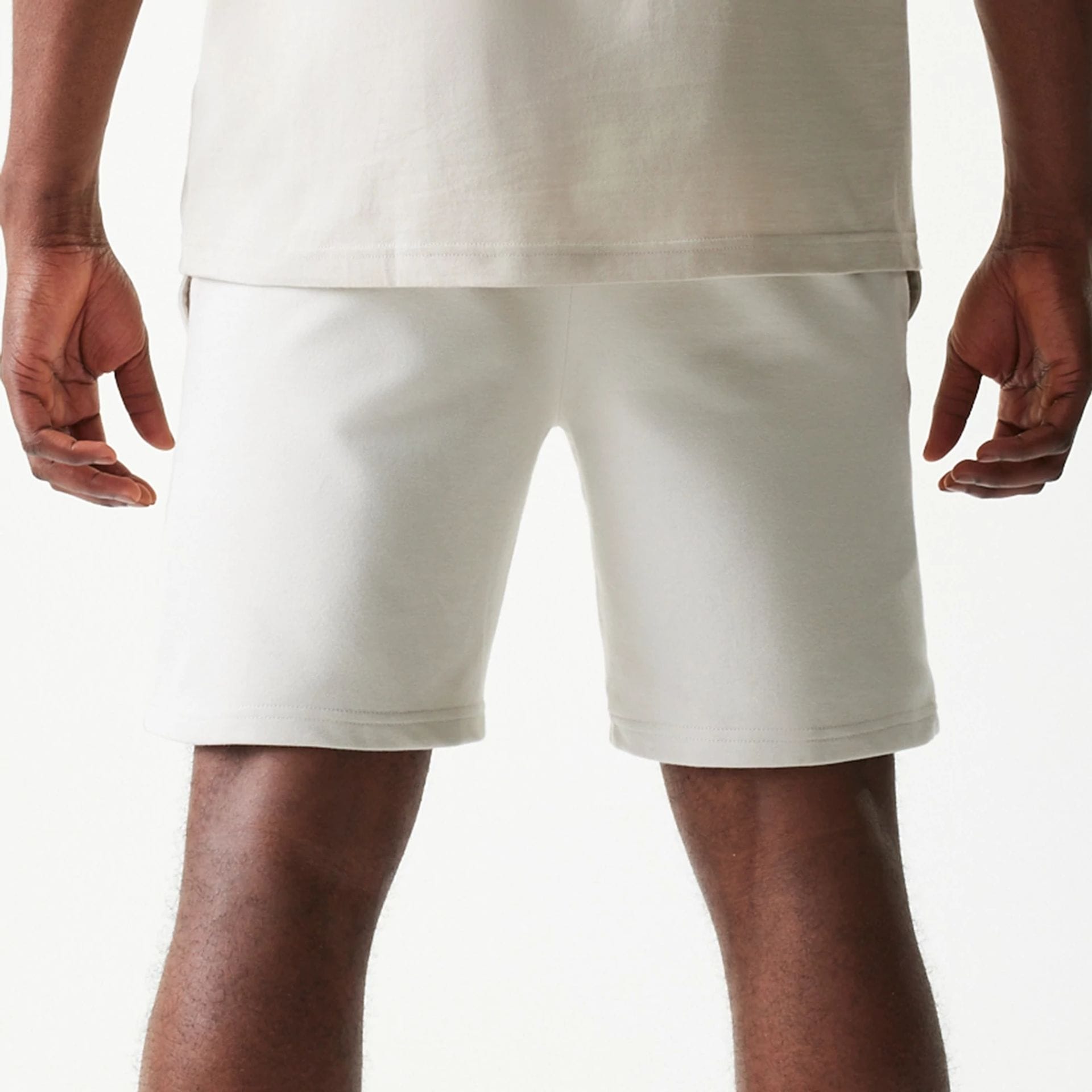 The model is wearing this NBA League Essential LA Lakers Shorts in cream. 6